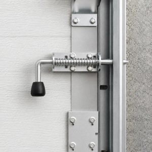 Verrou interne à ressort pour porte sectionnelle